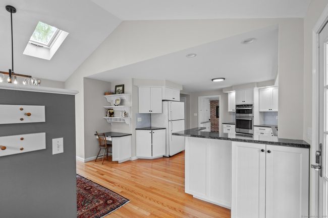 Welcoming side entrance brings you into the tastefully remodeled kitchen. | Image 5