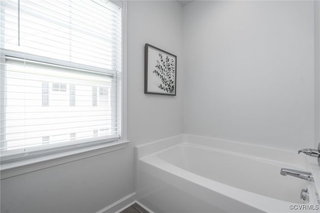 Primary Bathroom with Soaking Tub, Dual Vanity, Separate Commode, and Linen Closet | Image 16