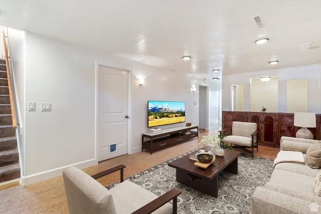Living area with stairway and baseboards | Image 20