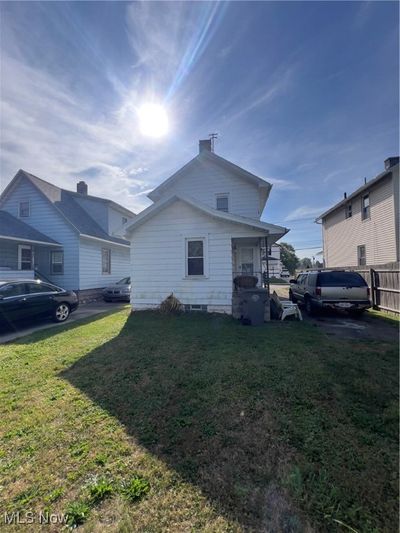 View of side of home with a lawn | Image 3