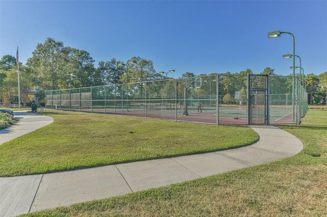 Onsite tennis facilities and scenic walking paths at Liberty Lake Park. | Image 47