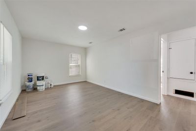 Spare room featuring light hardwood / wood-style floors | Image 3