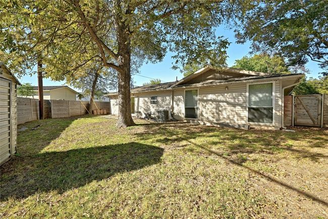 Tall pecan trees shade the backyard, making it easy to sit out and enjoy the outdoors. | Image 30