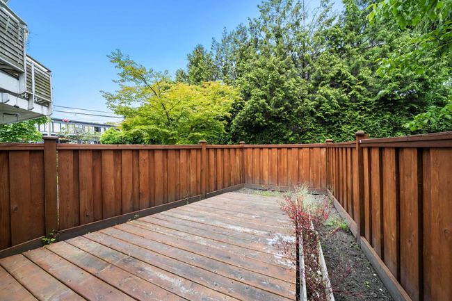 Wooden deck featuring a fenced backyard | Image 5