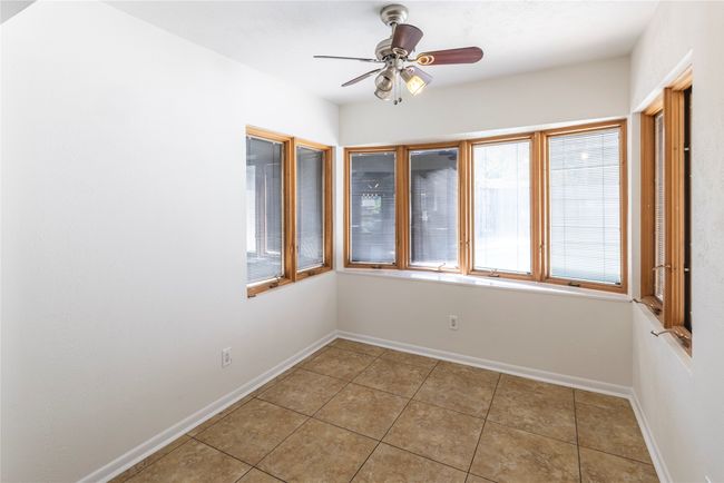 Bay-styled windows provide a bright and sunny space for breakfast. | Image 14