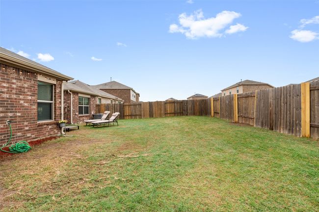 View of yard featuring a fenced backyard | Image 34