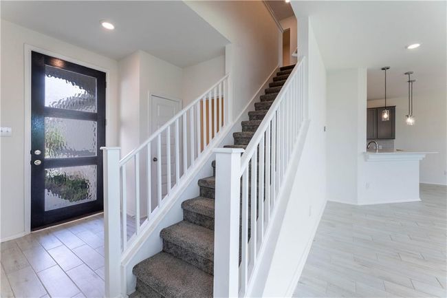 Entryway featuring stairs, recessed lighting, and light wood-style flooring | Image 17