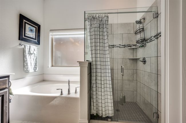 Primary bathroom with separate tub and shower. | Image 12