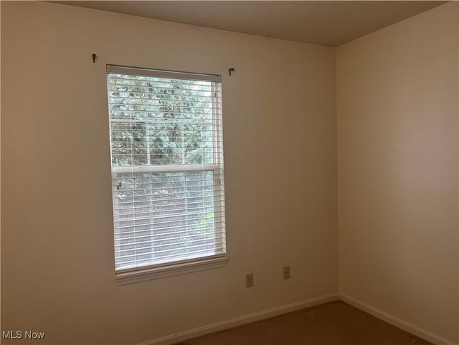 Carpeted Second Bedroom with window. | Image 15