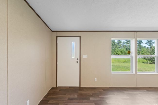 Foyer with wood finished floors and a textured ceiling | Image 38