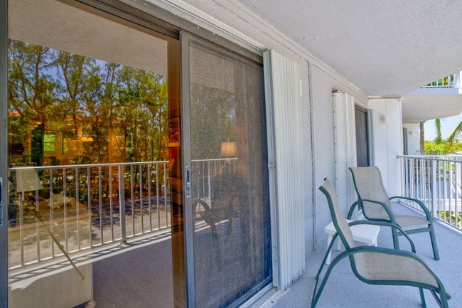 View of patio with ocean behind | Image 17