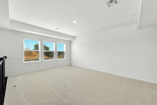 Unfurnished room with light colored carpet and baseboards | Image 21