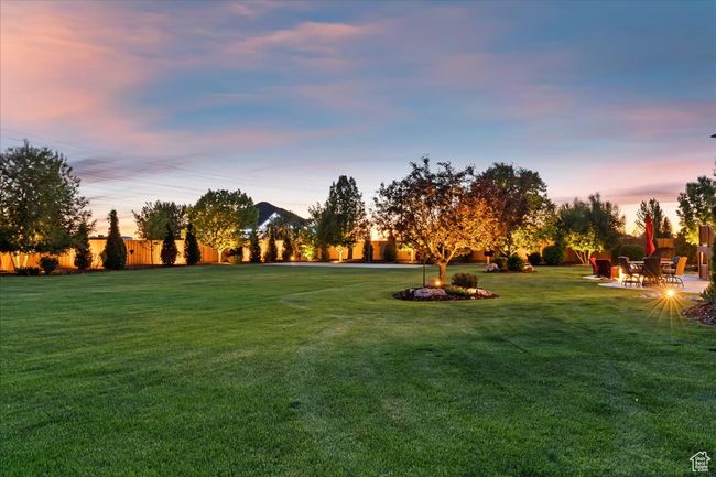 View of property's community featuring a yard and a patio area | Image 69