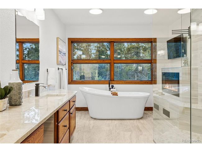 9303 Dauntless Way, House other with 4 bedrooms, 4 bathrooms and null parking in Conifer CO | Image 31