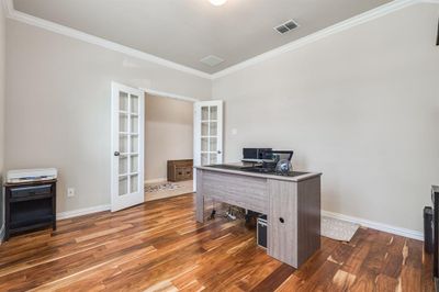 Office with ornamental molding, hardwood / wood-style flooring, and french doors | Image 3