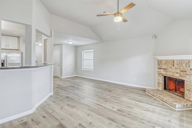 Additional features include an updated ceiling fan overhead, and just ahead, a bright nook near the window offers plenty of space for a cozy breakfast table. | Image 11