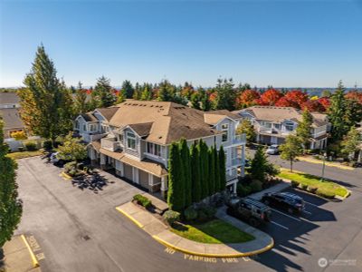 Amazing opportunity to own this gorgeous open concept top floor corner unit with Olympics views. | Image 2