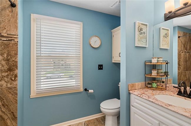 Bathroom with hardwood / wood-style flooring, vanity, toilet, and walk in shower | Image 34