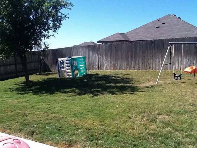 View of fenced backyard | Image 11