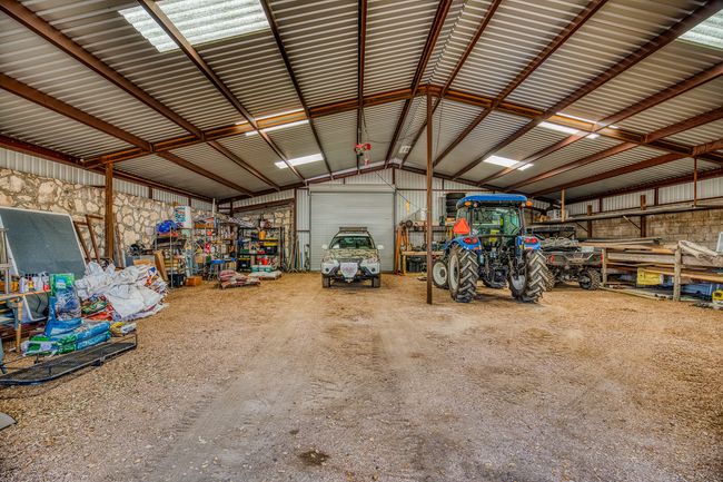 Garage featuring metal wall | Image 32