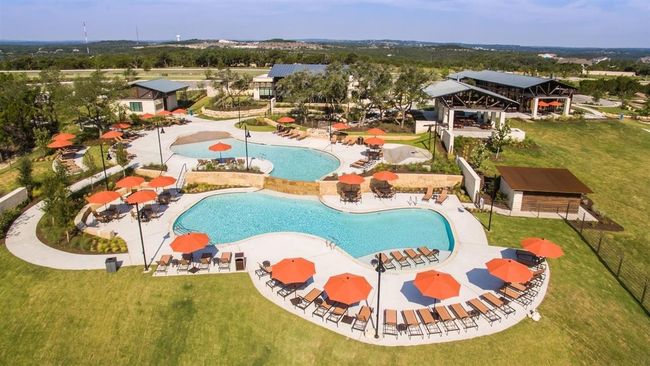 Community pool with a yard | Image 21