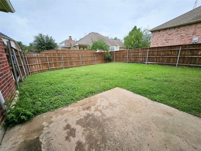 Fenced backyard featuring a patio | Image 31