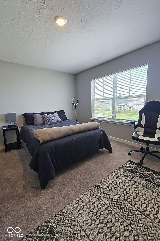 carpeted bedroom with baseboards | Image 20