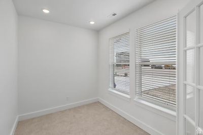 Spare room featuring a healthy amount of sunlight and carpet flooring | Image 2