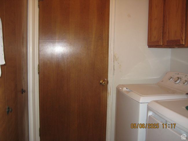 Laundry area featuring washer and dryer and cabinet space | Image 19
