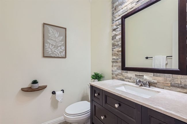 Convenient half bath for guests on the main level. | Image 8