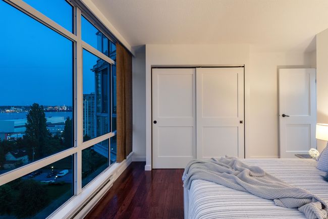 Bedroom with a closet and dark wood finished floors | Image 34