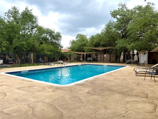 Community pool featuring fence and a patio | Image 18