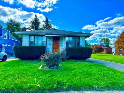 View of front of property featuring a front lawn | Image 1