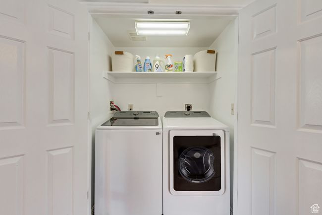 Washroom featuring washer and clothes dryer and laundry area | Image 15