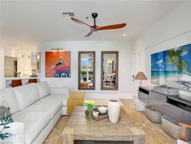 Living area featuring ceiling fan and recessed lighting | Image 21
