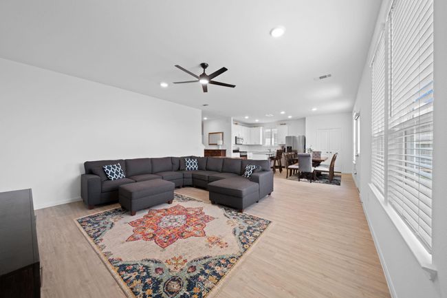 The home boasts an open floor plan, seamlessly connecting the kitchen, dining, and living area. | Image 14
