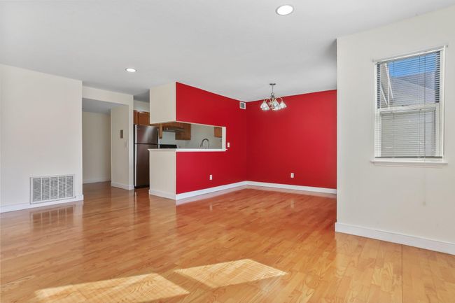 View of dining room, kitchen and entry from living space | Image 12