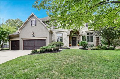 View of front of home featuring a garage and a front lawn | Image 1