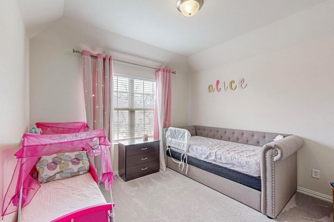 Bedroom with vaulted ceiling and light colored carpet | Image 26