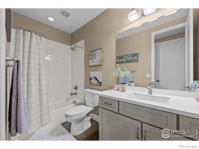 Shared basement bathroom with tub-shower | Image 23
