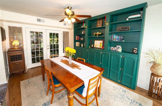 Dining room with french doors, ceiling fan, and light flooring | Image 4