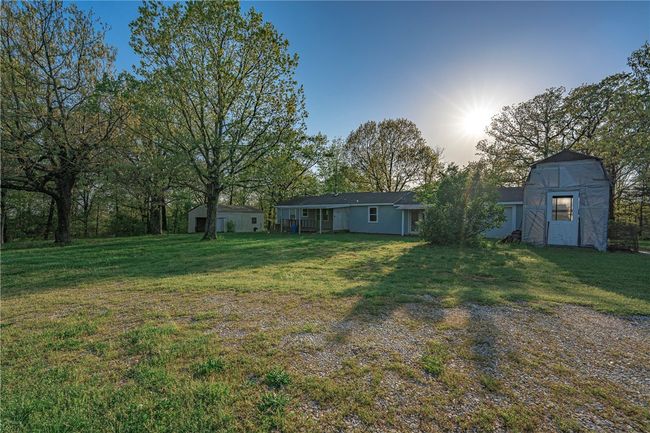 Back of the house with covered porch and greenhouse | Image 18