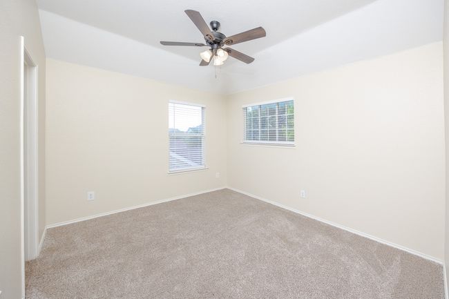 Bedroom 2 featuring carpet floors and ceiling fan | Image 25