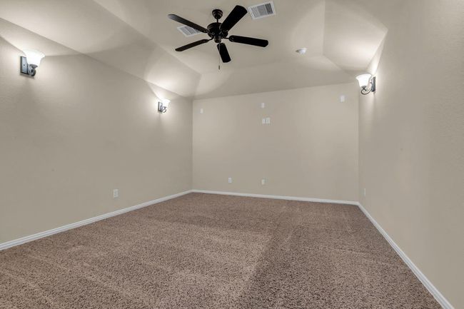 Experience movie nights like never before in this dedicated third story media room, designed for comfort and entertainment. | Image 30