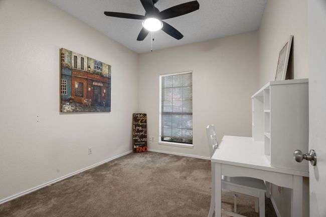 Carpeted home office with ceiling fan and baseboards | Image 24