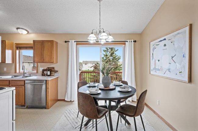 Dining Room with slider to deck with trees for privacy | Image 5