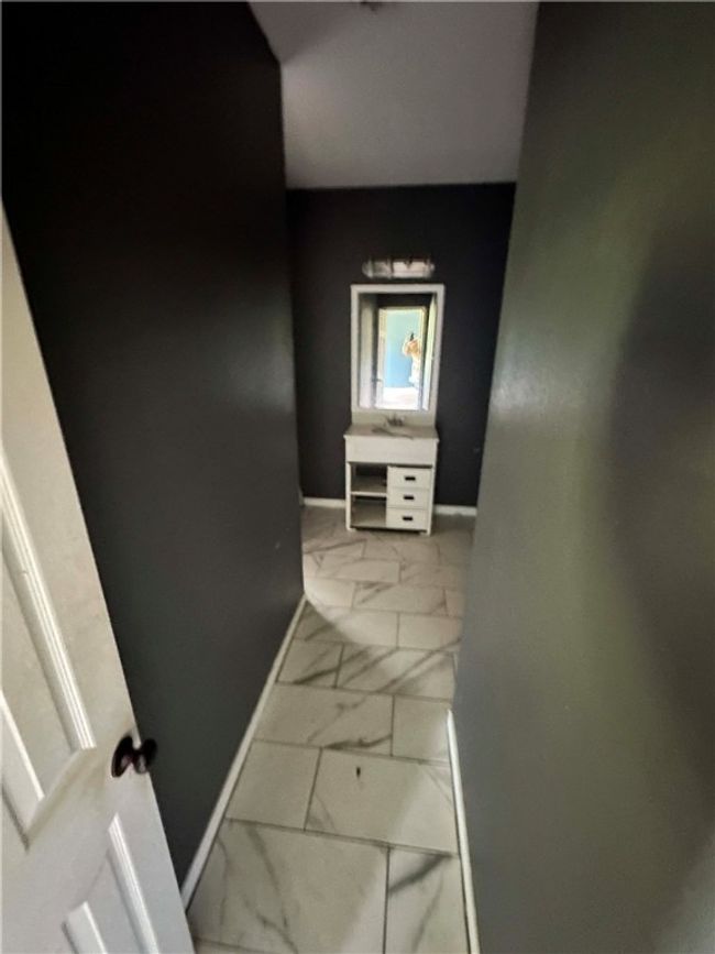 Corridor featuring marble finish flooring and baseboards | Image 10