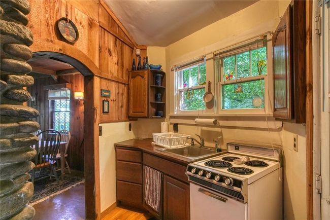 Kitchen with sink, light hardwood / wood-style floors, and white electric range | Image 11