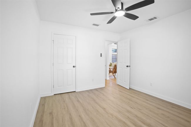 Unfurnished bedroom with light wood-style flooring and a ceiling fan | Image 17