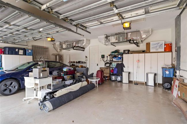 3-car garage with electric car station. two zone a/c, key pad garage entry. | Image 25